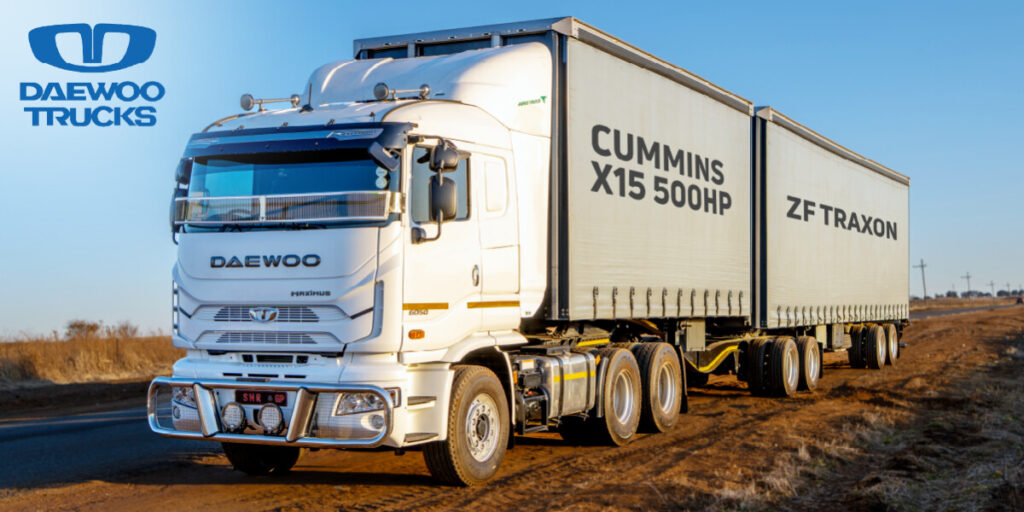 Daewoo truck with Cummins engine on road.