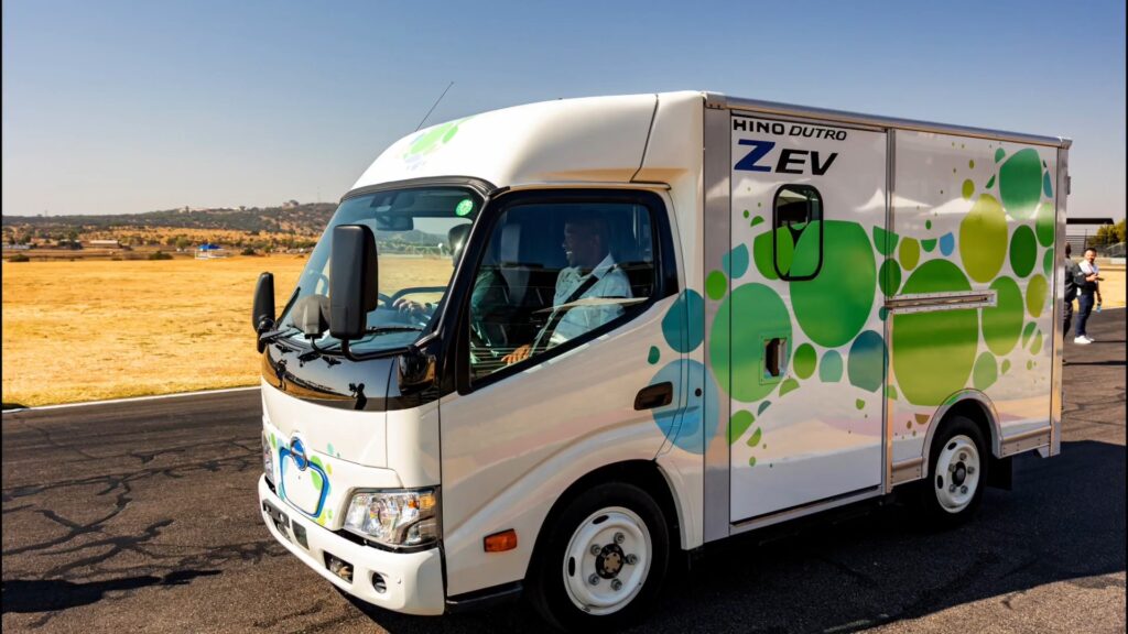 Electric delivery van on a sunny road